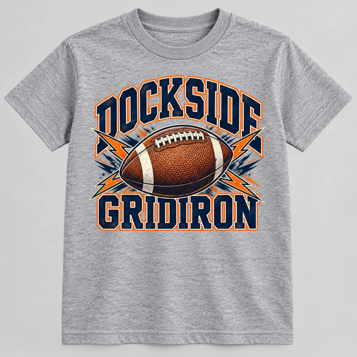 Sport Grey youth garment with collegiate Dockside Gridiron lettering, a football, and energetic orange and navy accents. Front view.